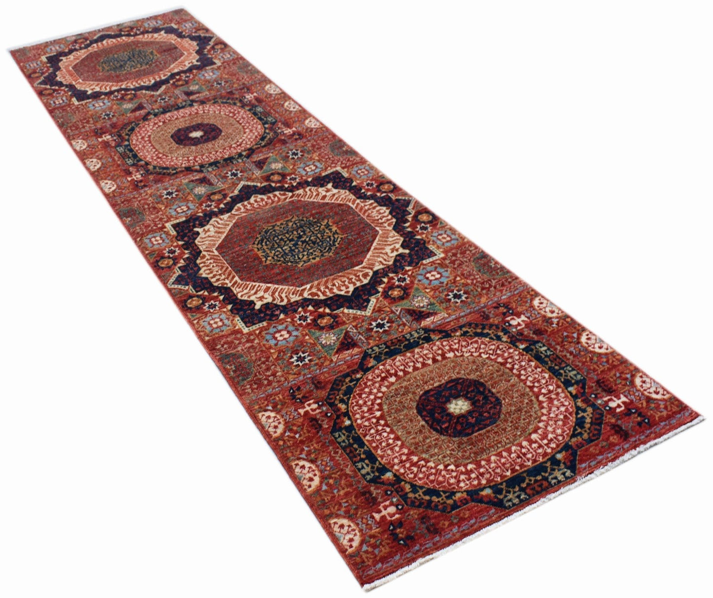 A handmade Afghan Chobi runner rug featuring a traditional Mamluk pattern with geometric medallions.