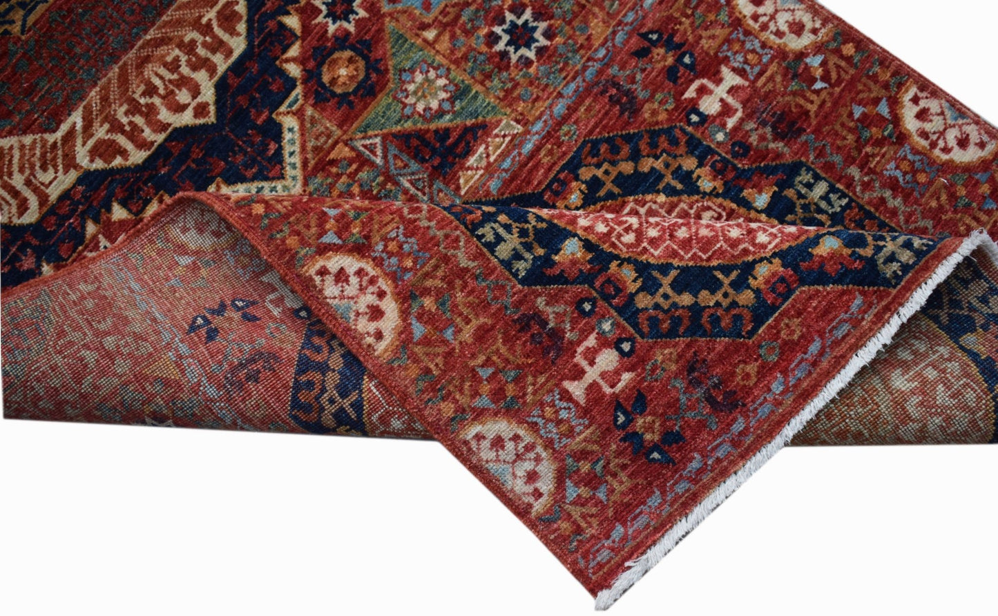 A handmade Afghan Chobi runner featuring a traditional red and blue Mamluk medallion pattern.