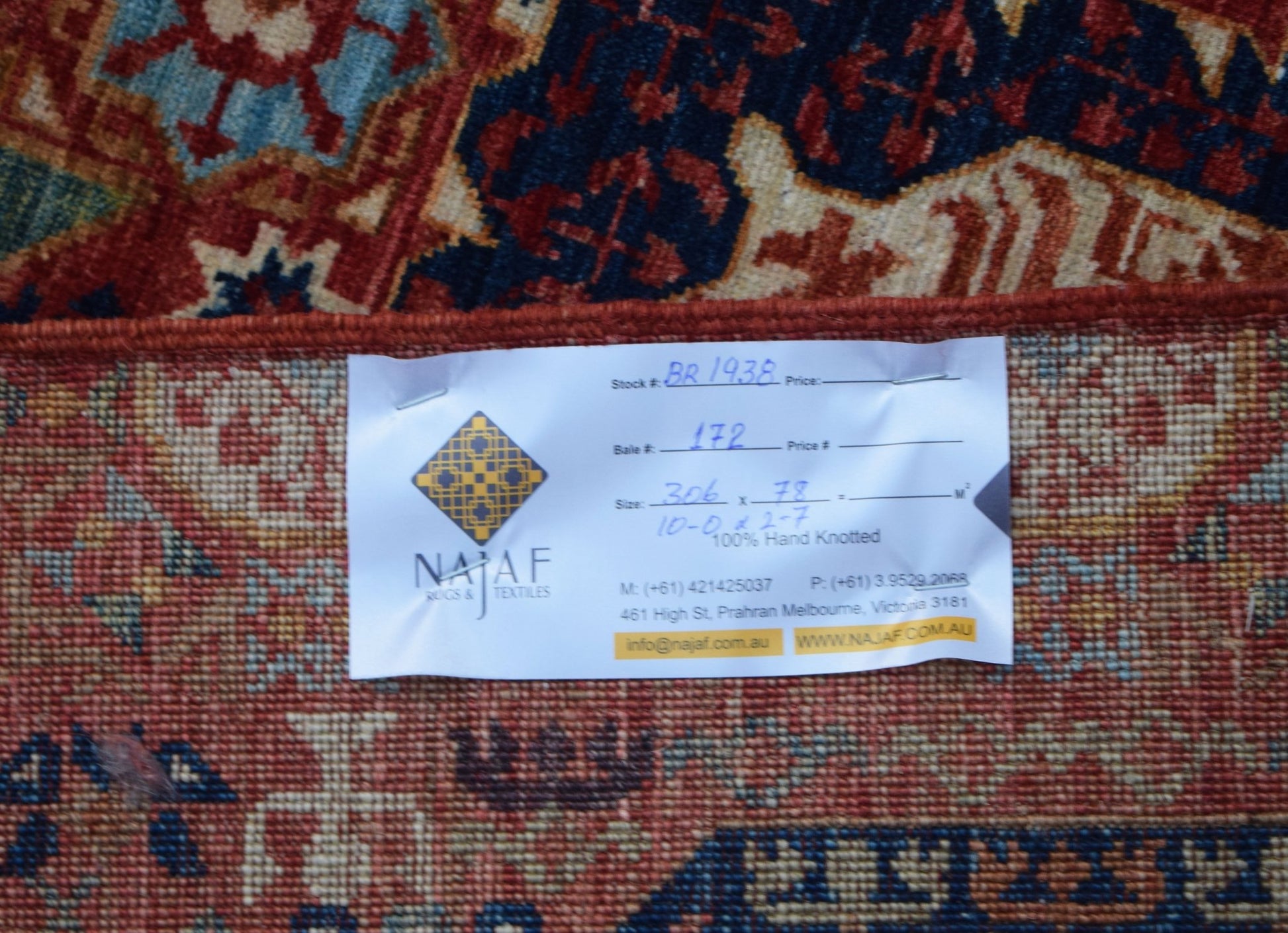 A hand-knotted Afghan Chobi runner featuring a traditional Mamluk medallion pattern in warm tones.