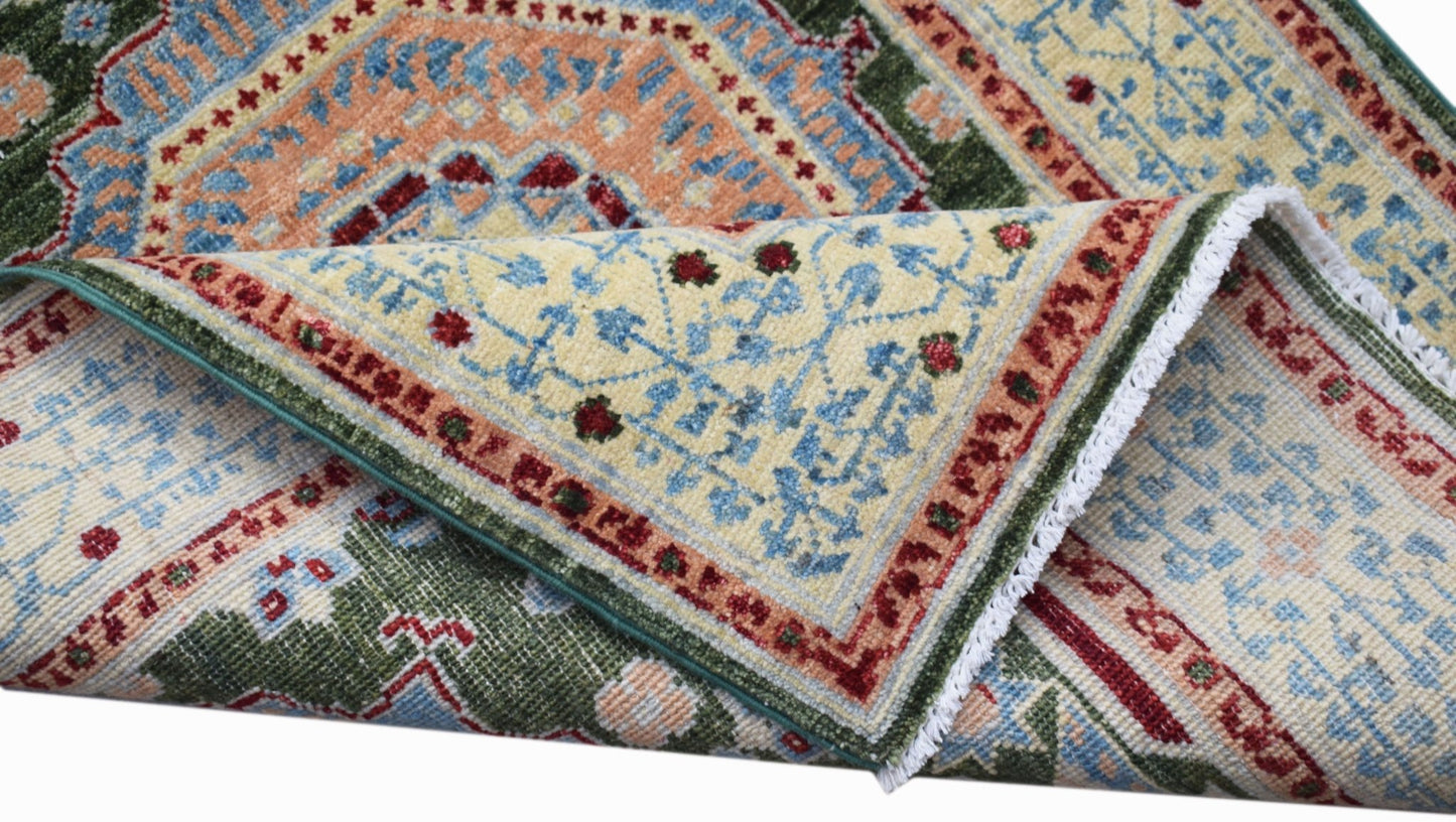 A handwoven Afghan Chobi runner featuring a traditional Mamluk medallion pattern in wool.