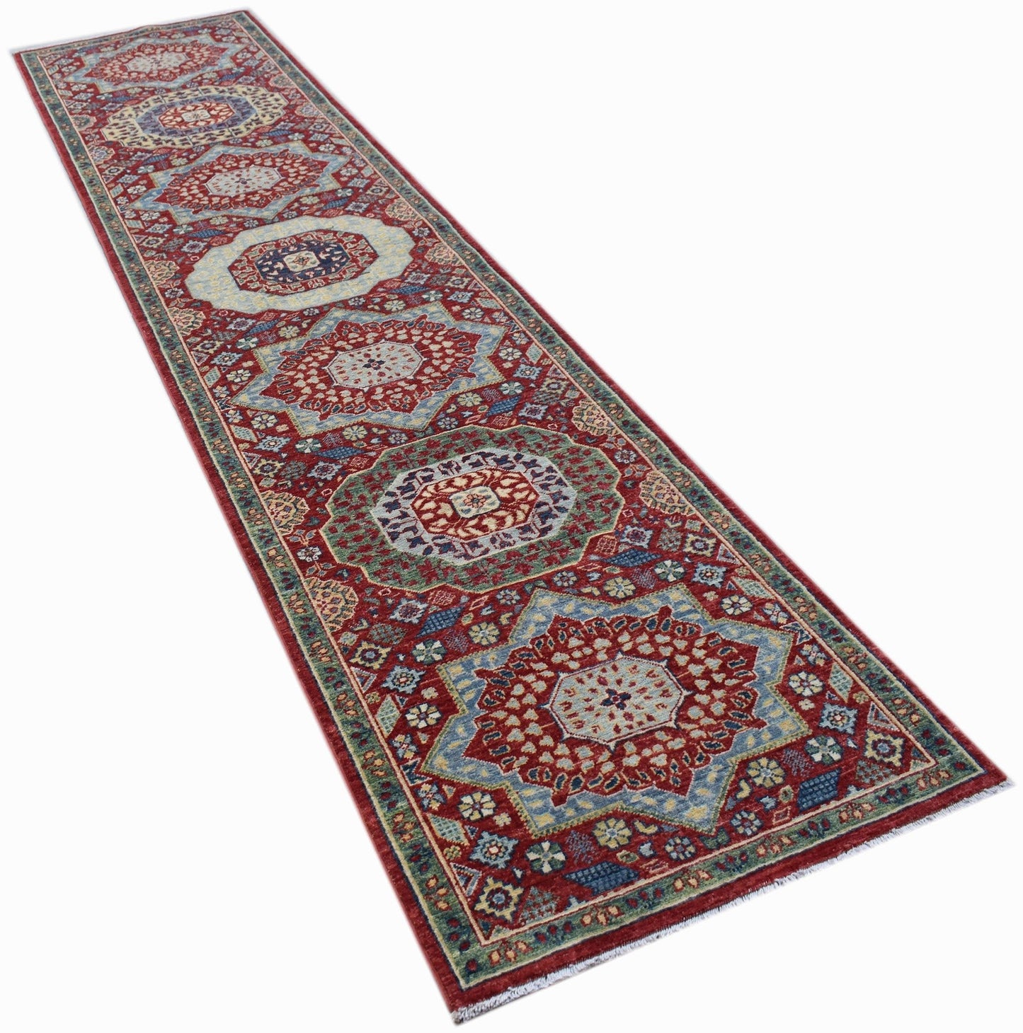 A handmade Afghan Chobi runner featuring a traditional Mamluk medallion pattern in red and blue.
