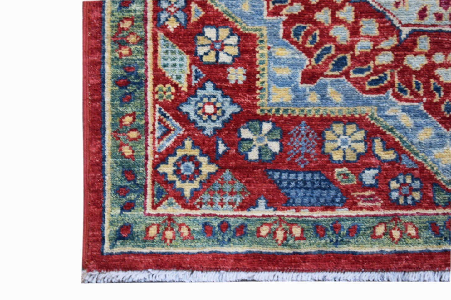 A handmade Afghan Chobi runner featuring a traditional Mamluk pattern in red, blue, and green.