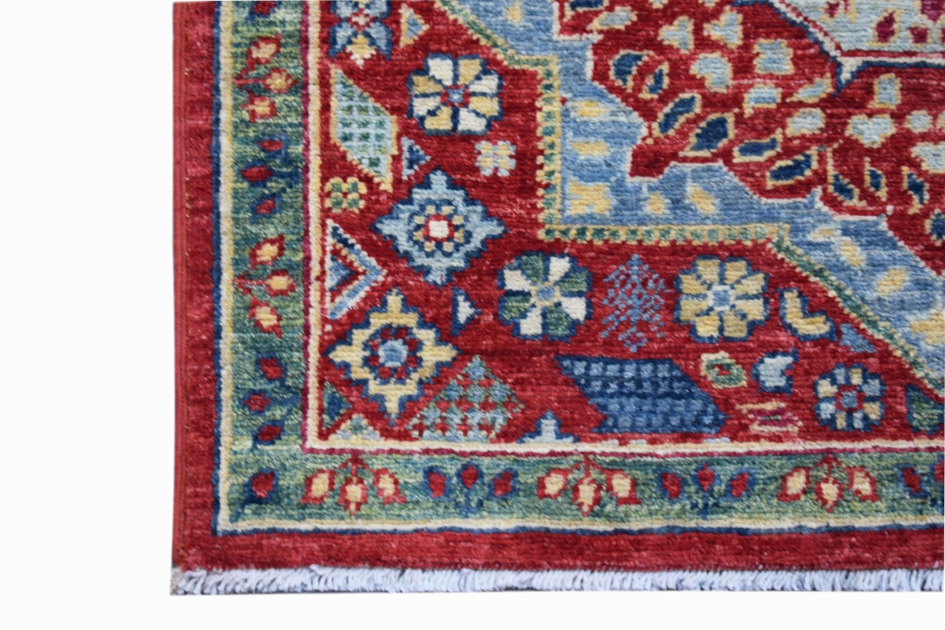 A handmade Afghan Chobi runner featuring a traditional Mamluk pattern in red, blue, and green.