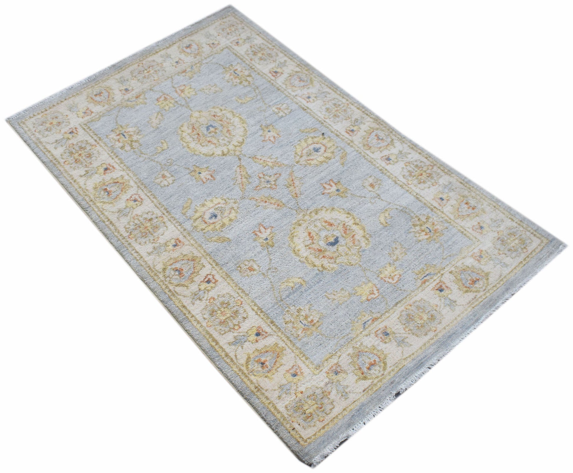 A rectangular Afghan Chobi rug featuring a light blue field with traditional floral patterns.