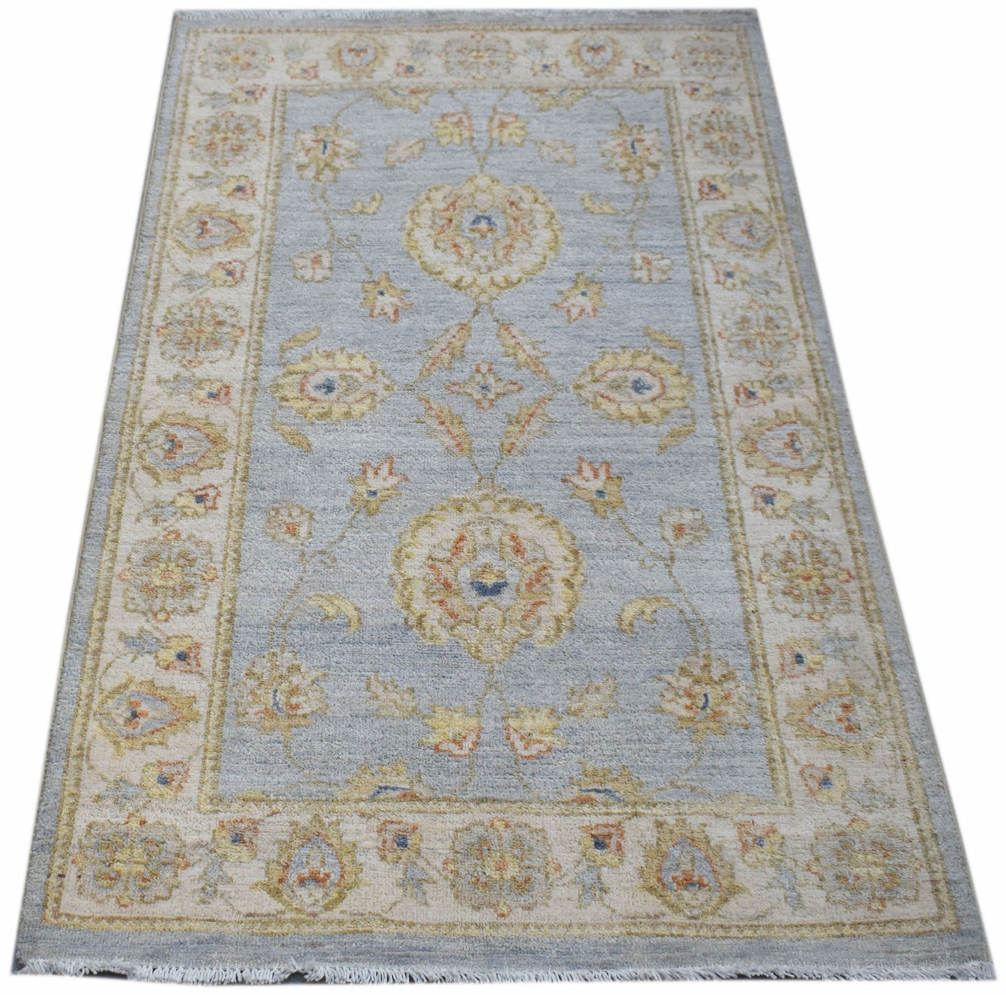 A rectangular Afghan Chobi rug featuring a light blue field with traditional floral patterns.