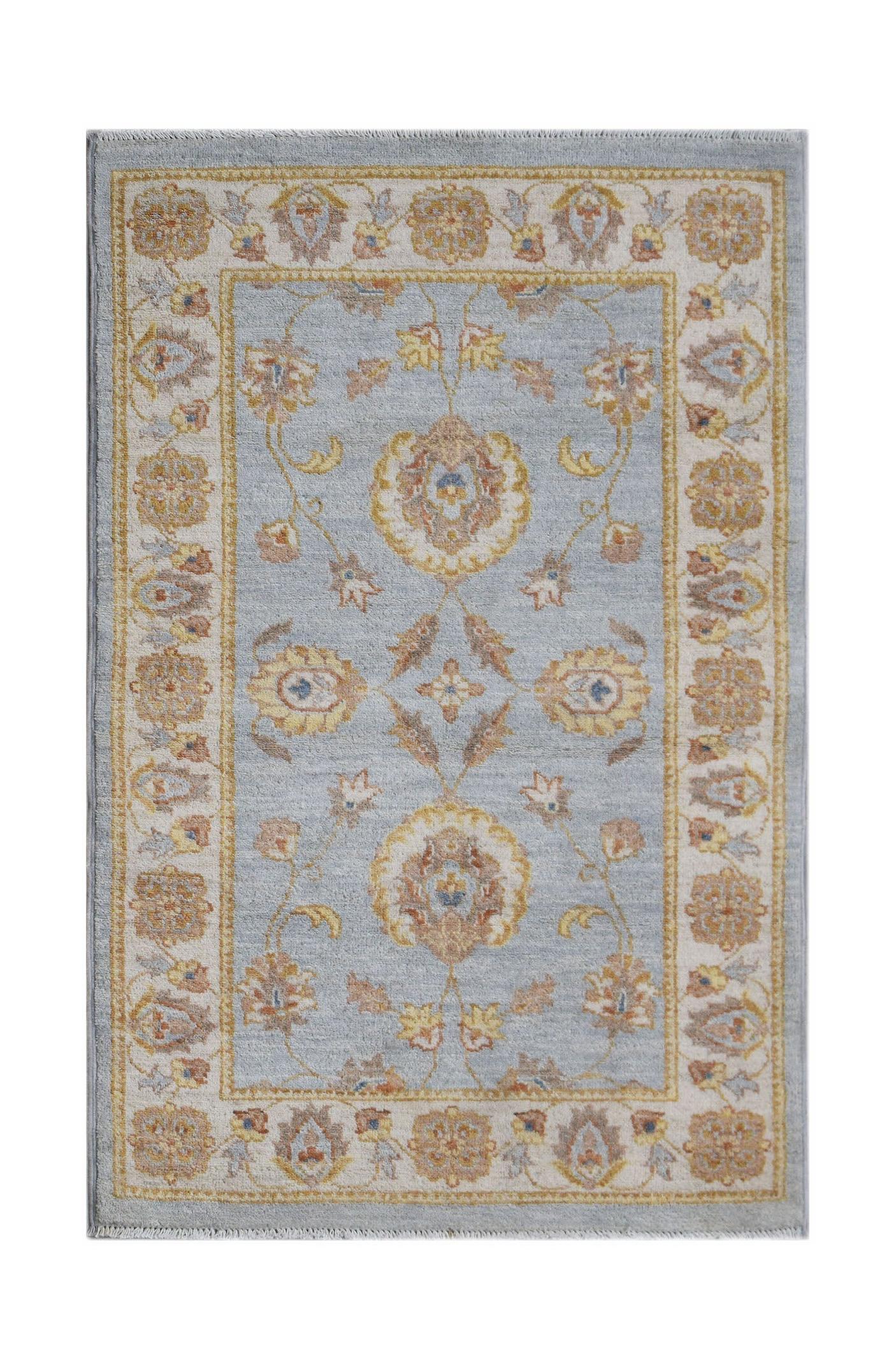 A rectangular Afghan Chobi rug featuring a light blue field with traditional floral motifs.