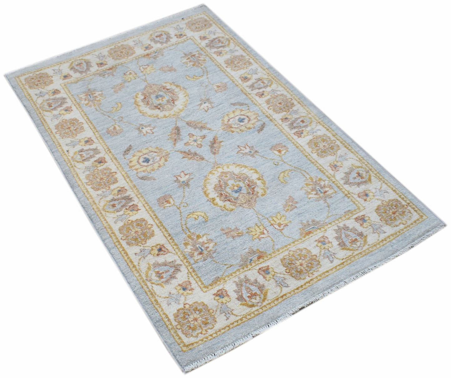 A rectangular Afghan Chobi rug featuring a light blue field with traditional floral patterns.