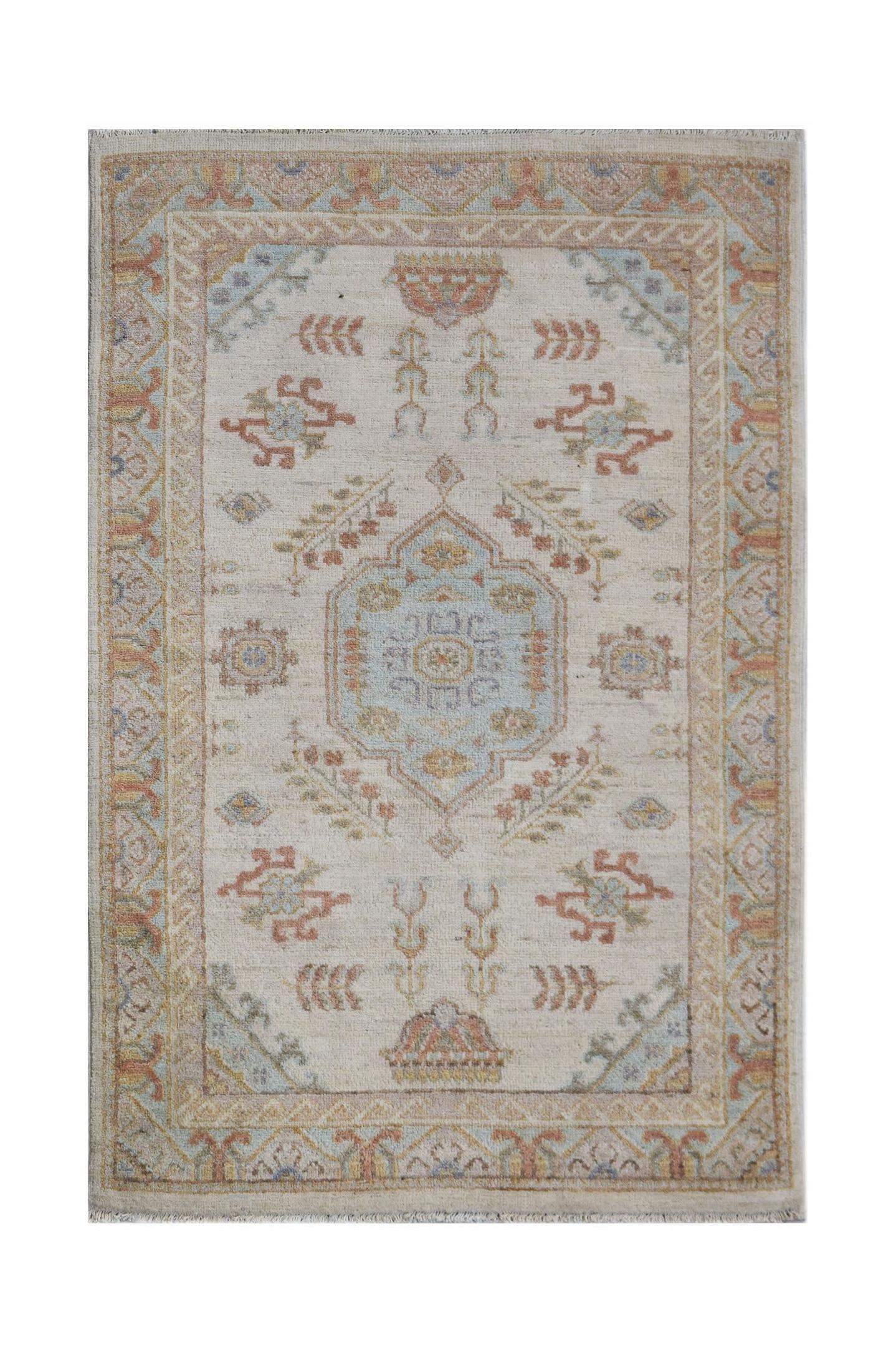 Handwoven Afghan Chobi rug featuring a traditional floral medallion pattern in soft earth tones.