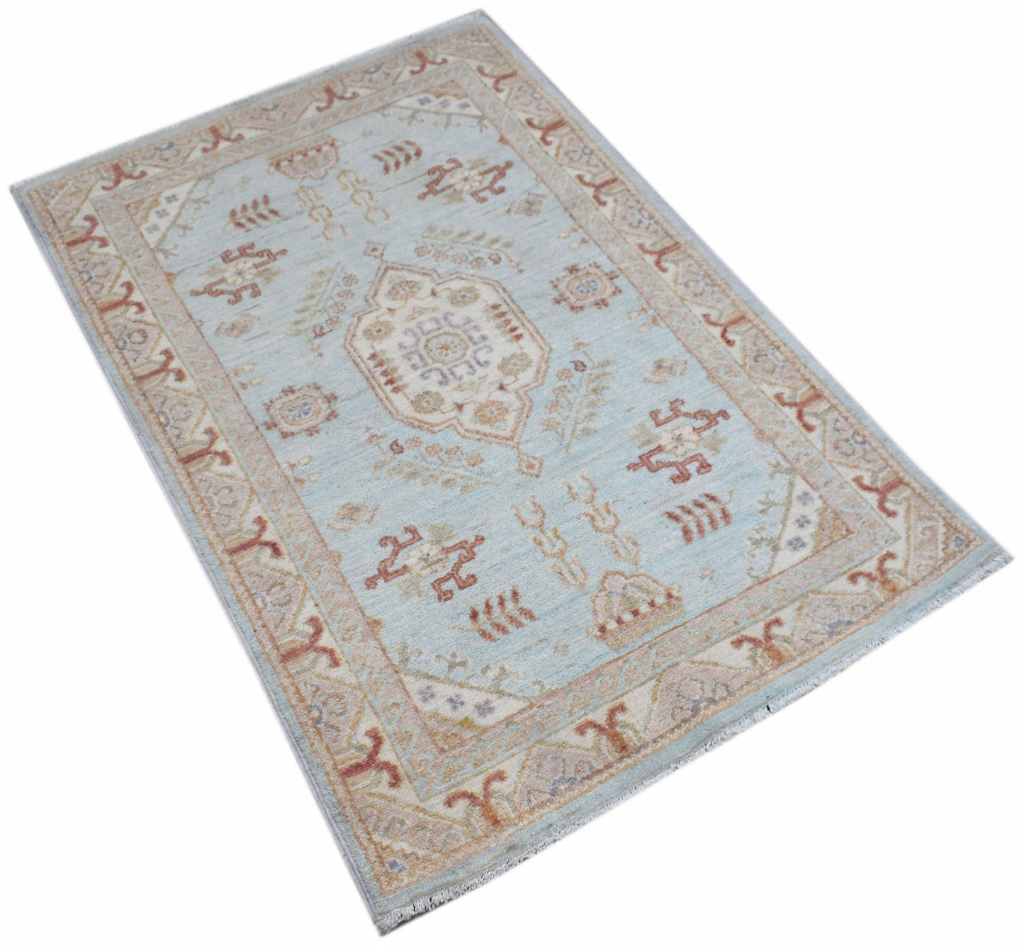 A rectangular Afghan Chobi rug featuring a light blue field with traditional geometric patterns.