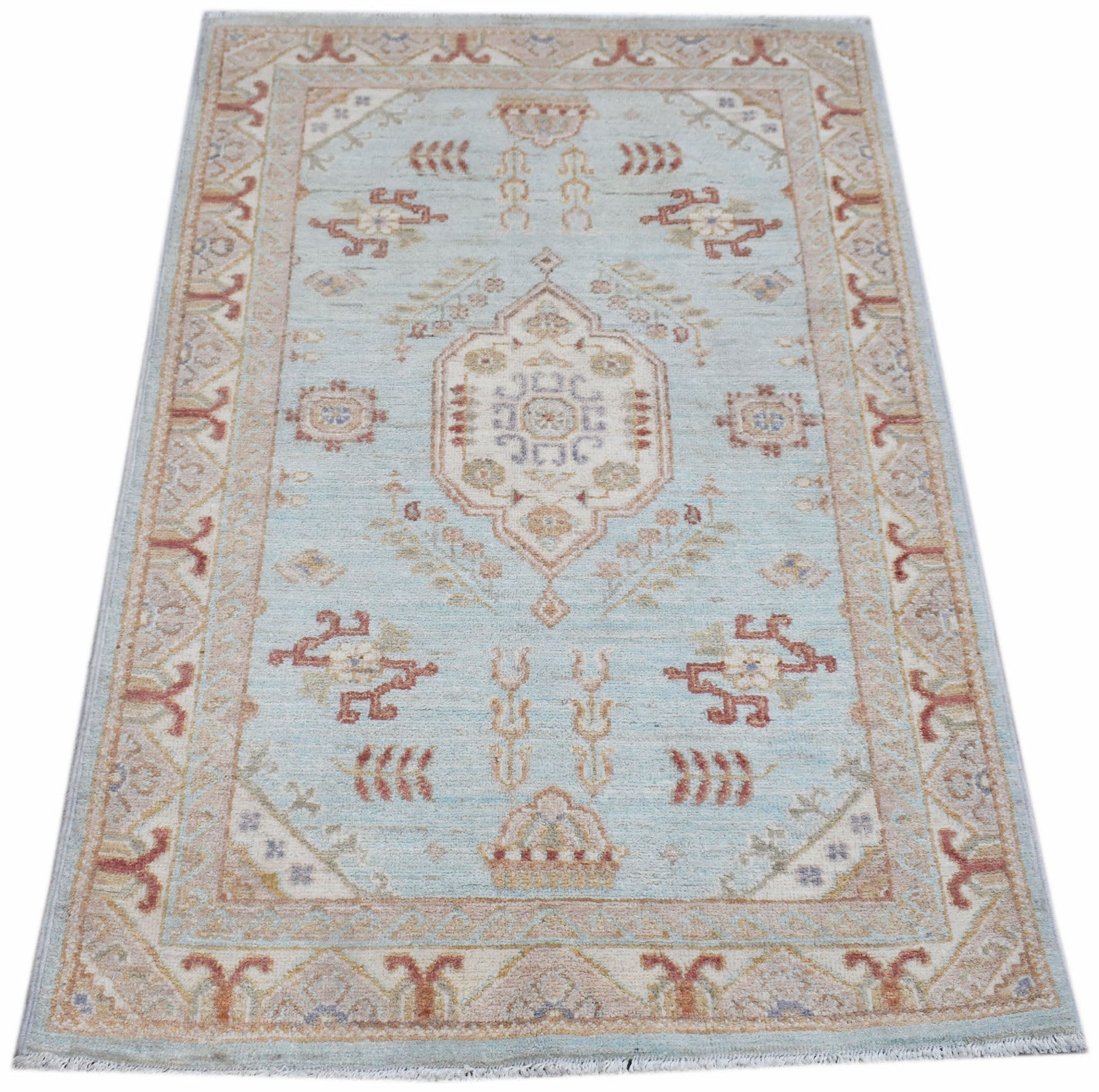 A rectangular Afghan Chobi rug featuring a traditional floral pattern in soft blue and beige tones.