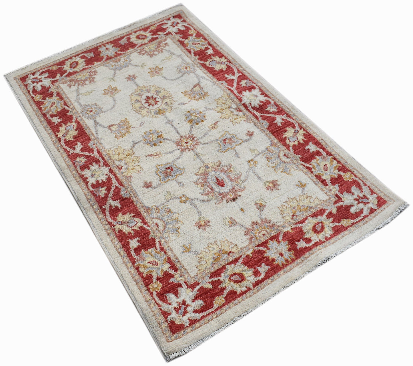 A rectangular Afghan Chobi rug featuring a cream field with floral motifs and a red border.