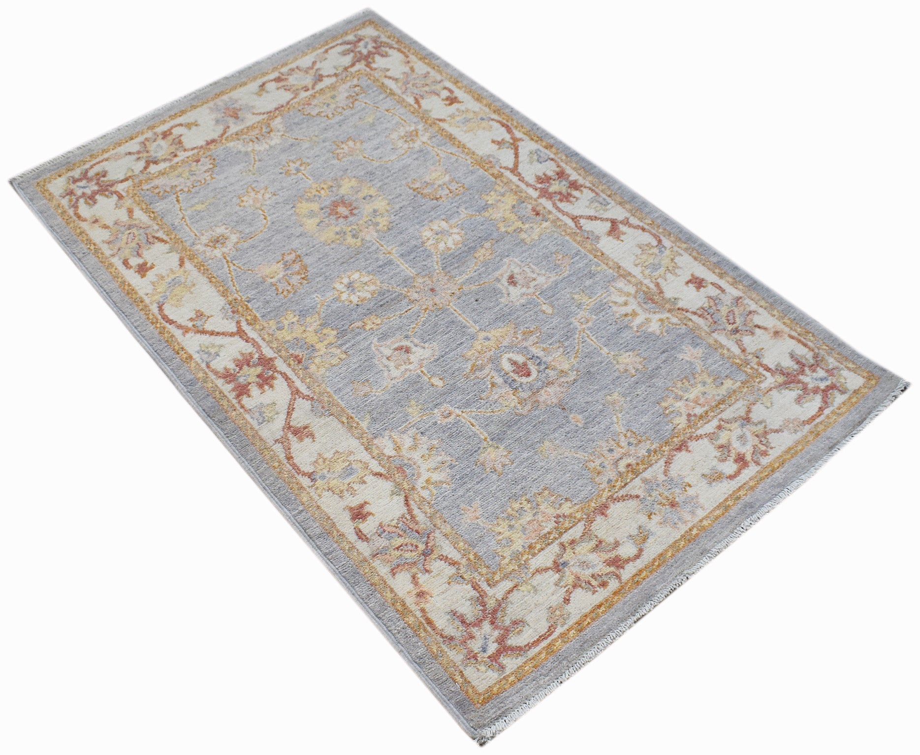 A rectangular Afghan Chobi rug featuring a floral pattern in muted tones on a light blue field.