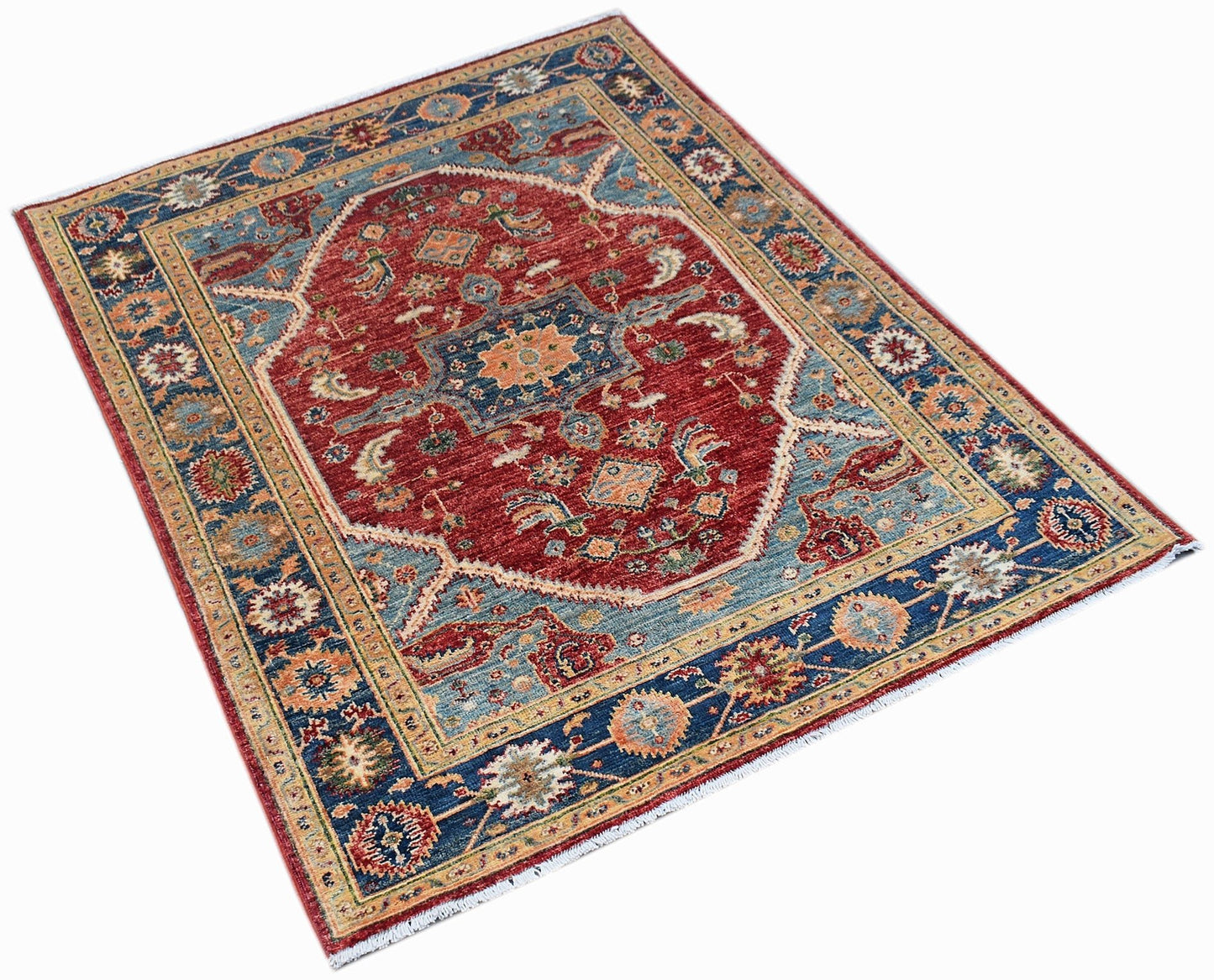 A rectangular Afghan Chobi rug featuring a traditional red and blue floral medallion pattern.