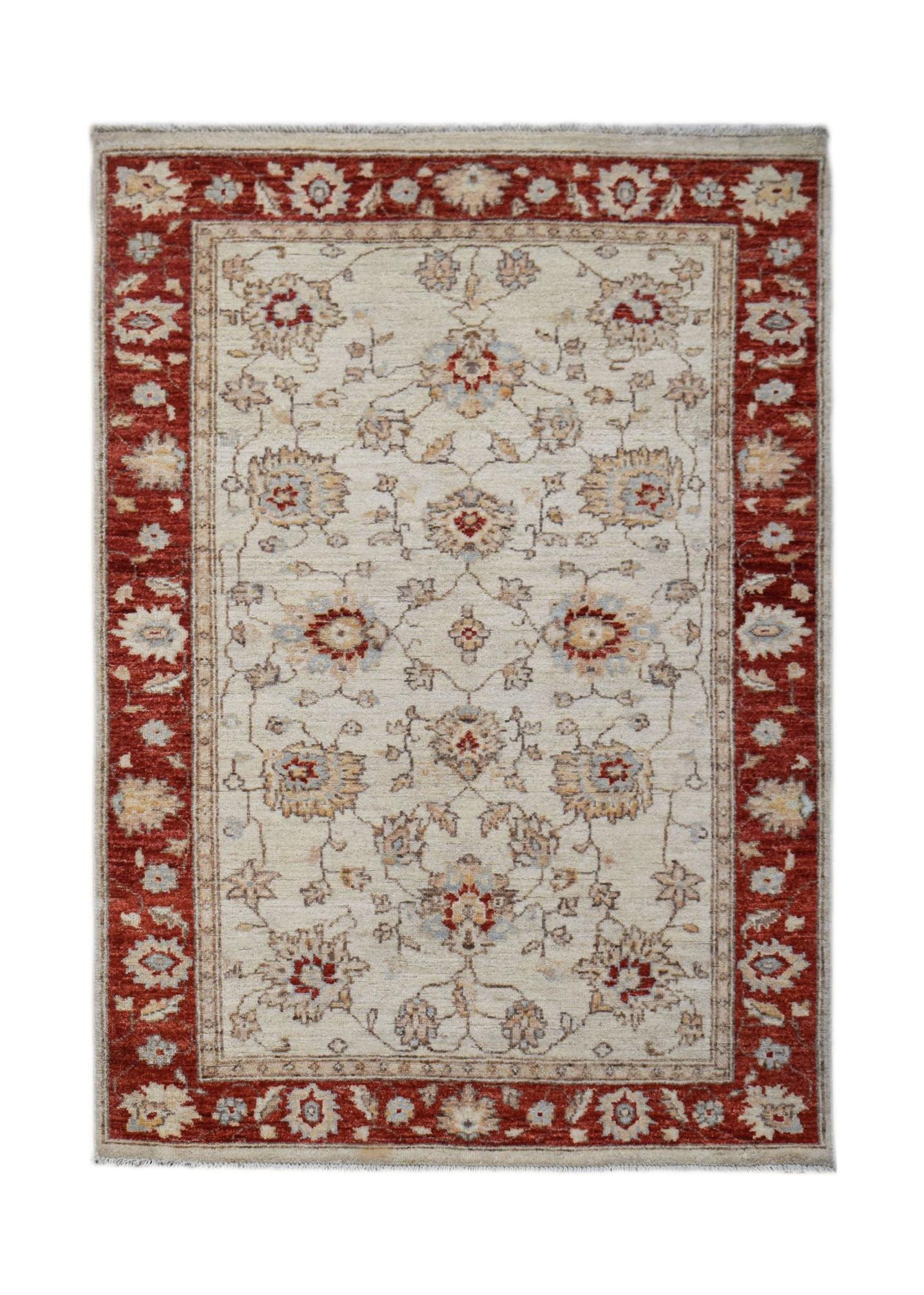 Handwoven Afghan Chobi rug featuring a floral pattern in red and beige tones.