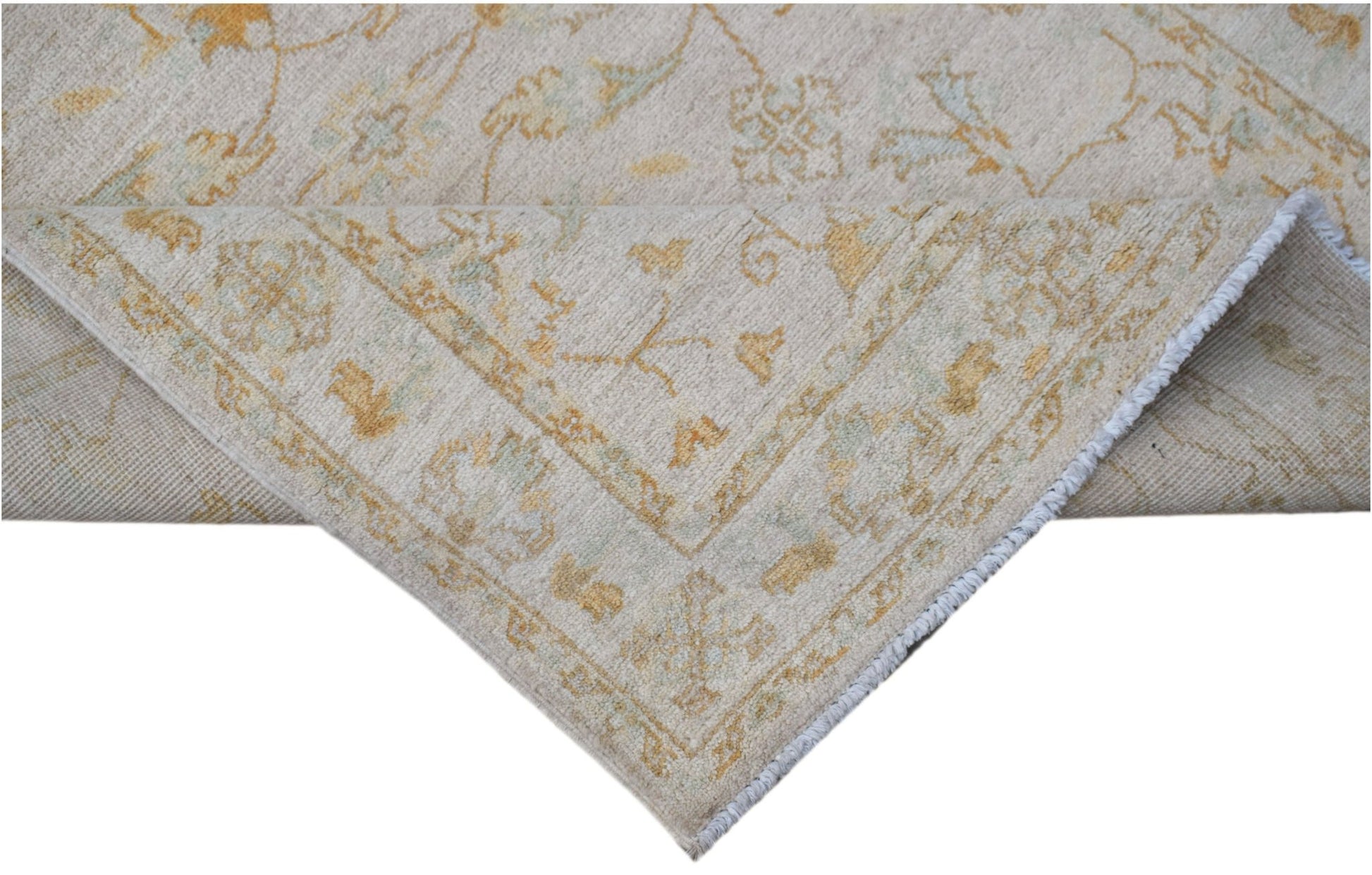 A handwoven Afghan Chobi rug featuring a traditional floral pattern in soft beige and gold tones.
