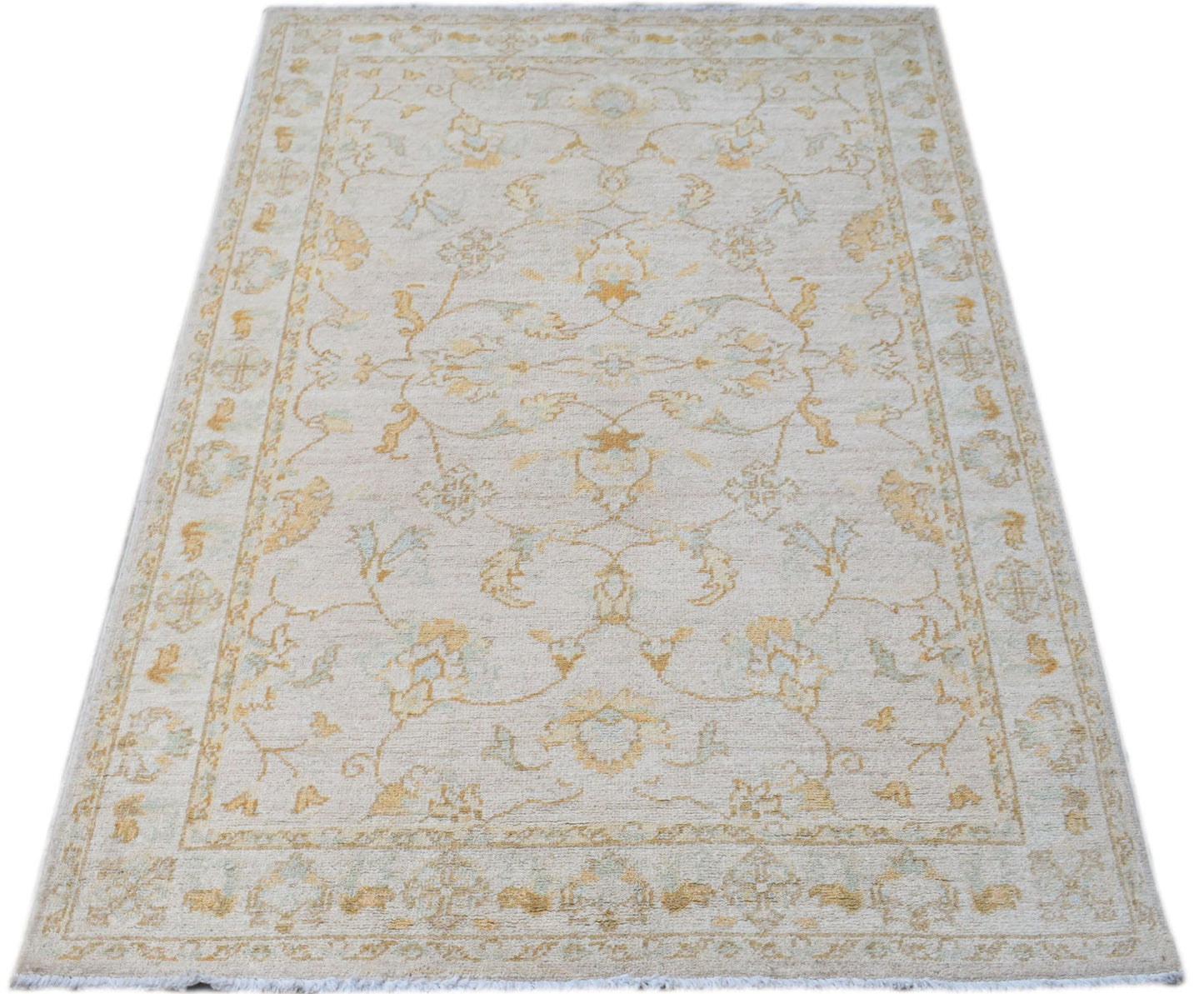 A rectangular Afghan Chobi rug featuring a traditional floral pattern in soft beige and gold tones.