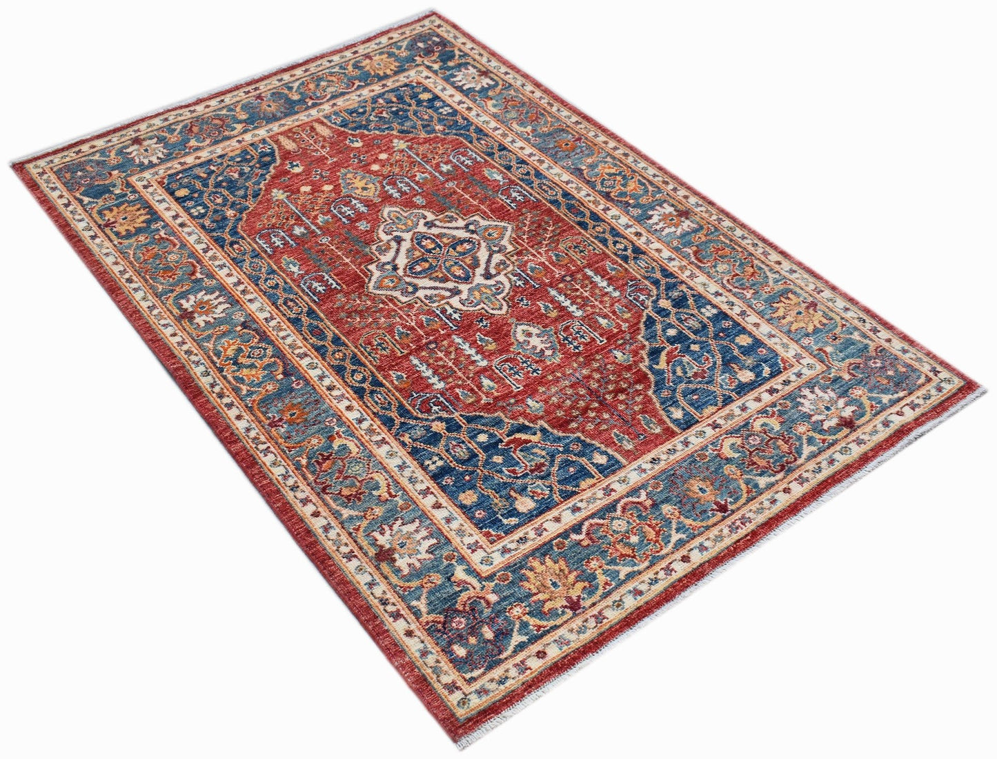 A rectangular Afghan Chobi rug featuring a traditional Heriz pattern in red and blue tones.