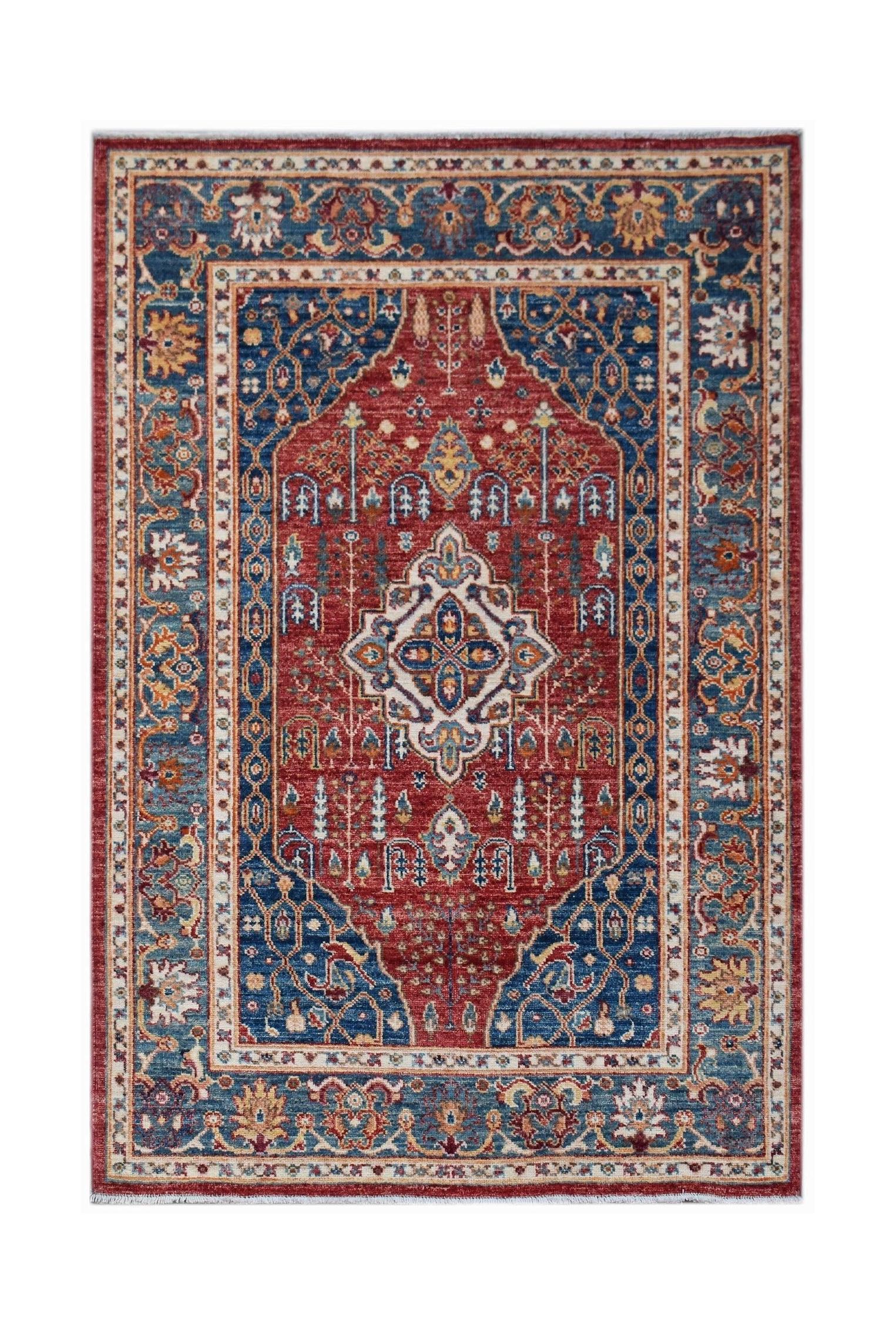 Handmade Afghan Chobi rug featuring a traditional Heriz pattern in red and blue wool.