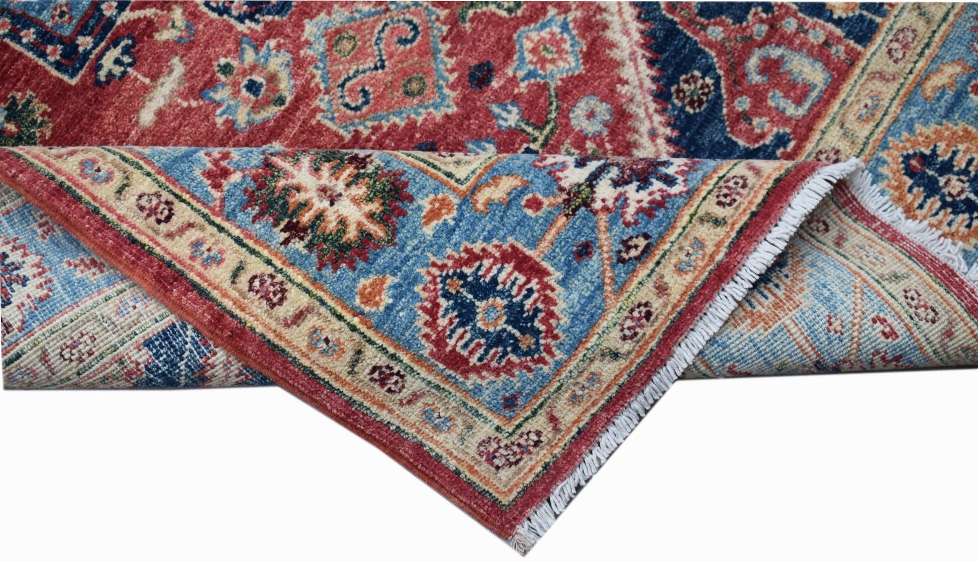 A handwoven Afghan Chobi rug featuring a traditional Heriz pattern in red and blue tones.