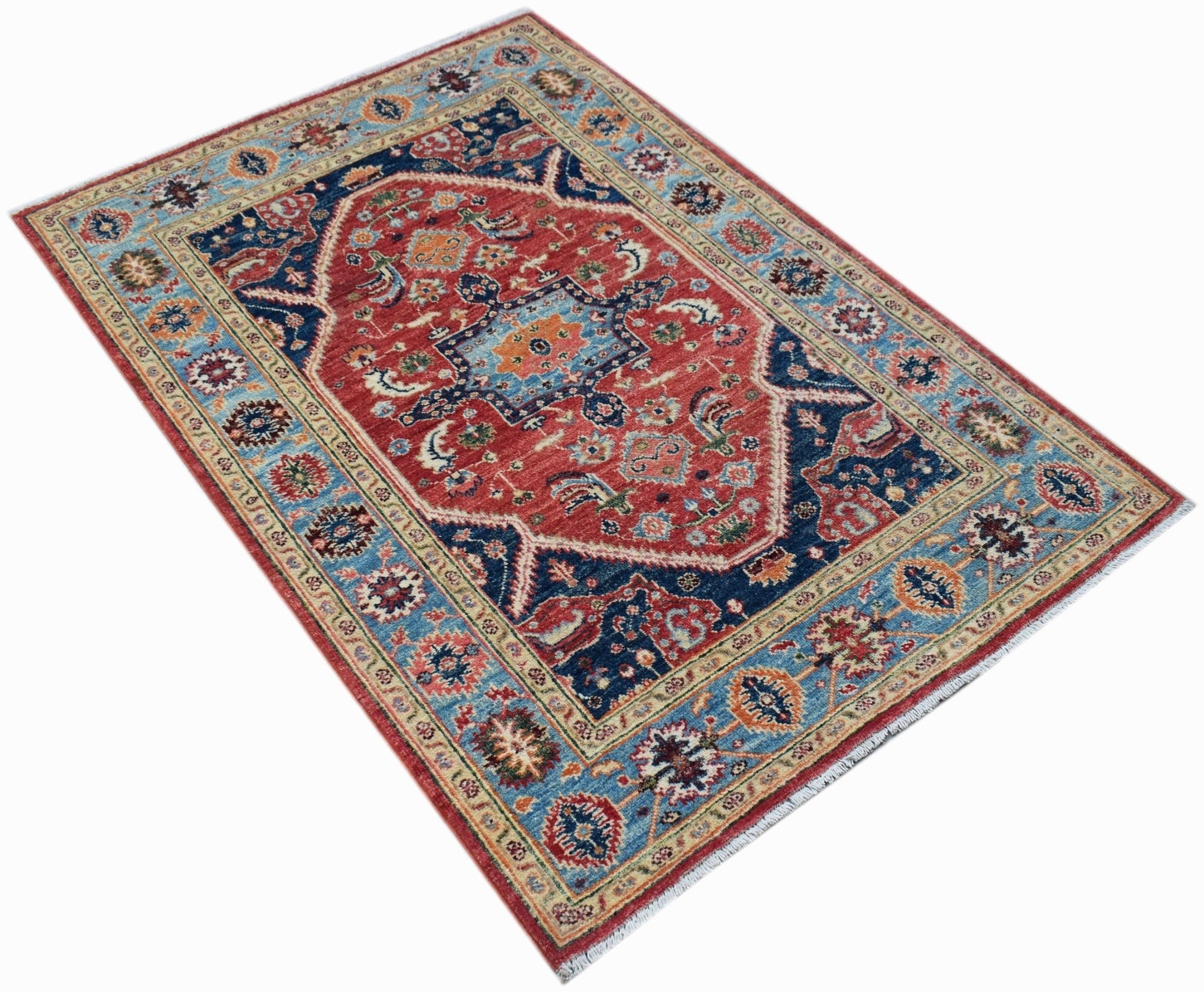 Handwoven Afghan Chobi rug featuring a traditional Heriz pattern in red and blue wool.