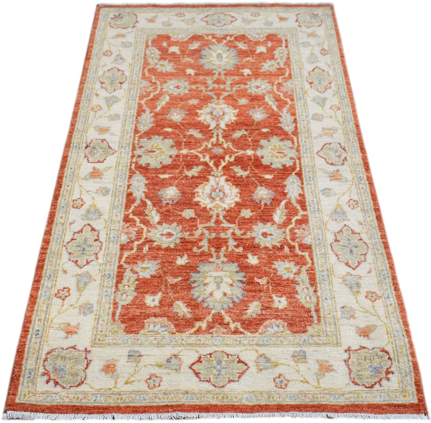 Handwoven Afghan Chobi rug featuring a traditional floral pattern in rust orange and cream tones.