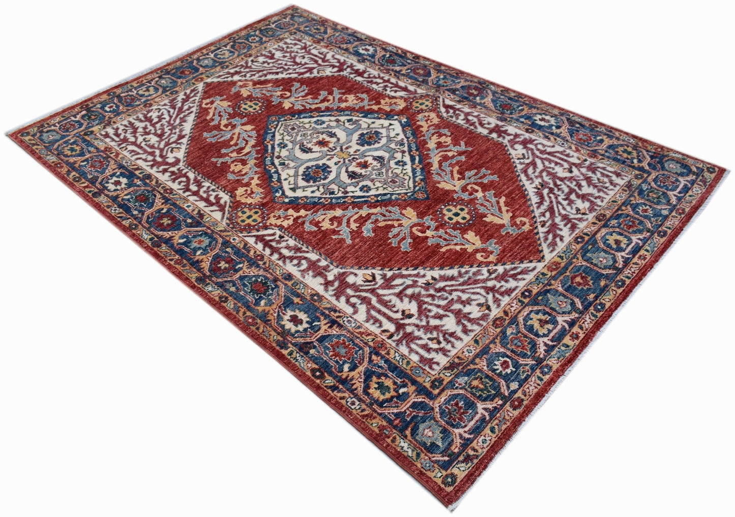 A rectangular Afghan Chobi rug featuring a traditional Heriz pattern in red, blue, and cream.
