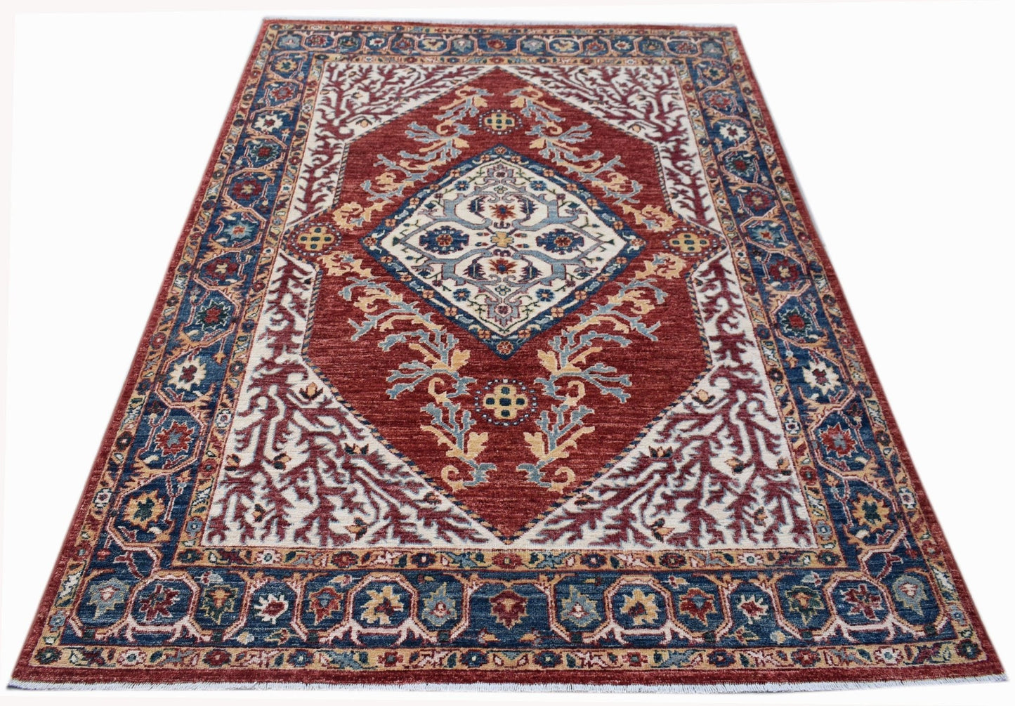 Handwoven Afghan Chobi rug featuring a traditional Heriz-style geometric pattern in red and blue.