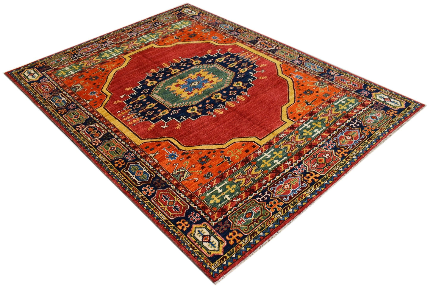 A rectangular Afghan Chobi rug featuring a central medallion on a red field with geometric borders.
