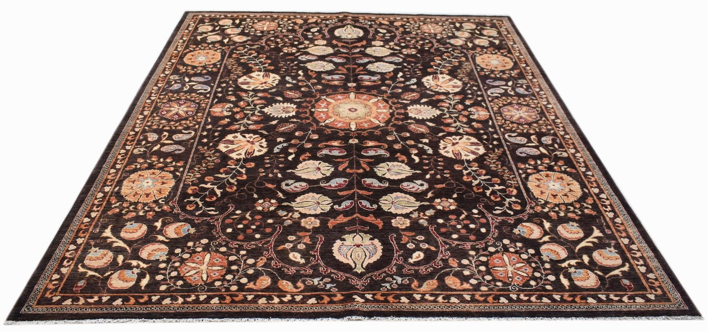 Handwoven Afghan Chobi rug featuring a traditional floral Suzani pattern on a dark brown background.