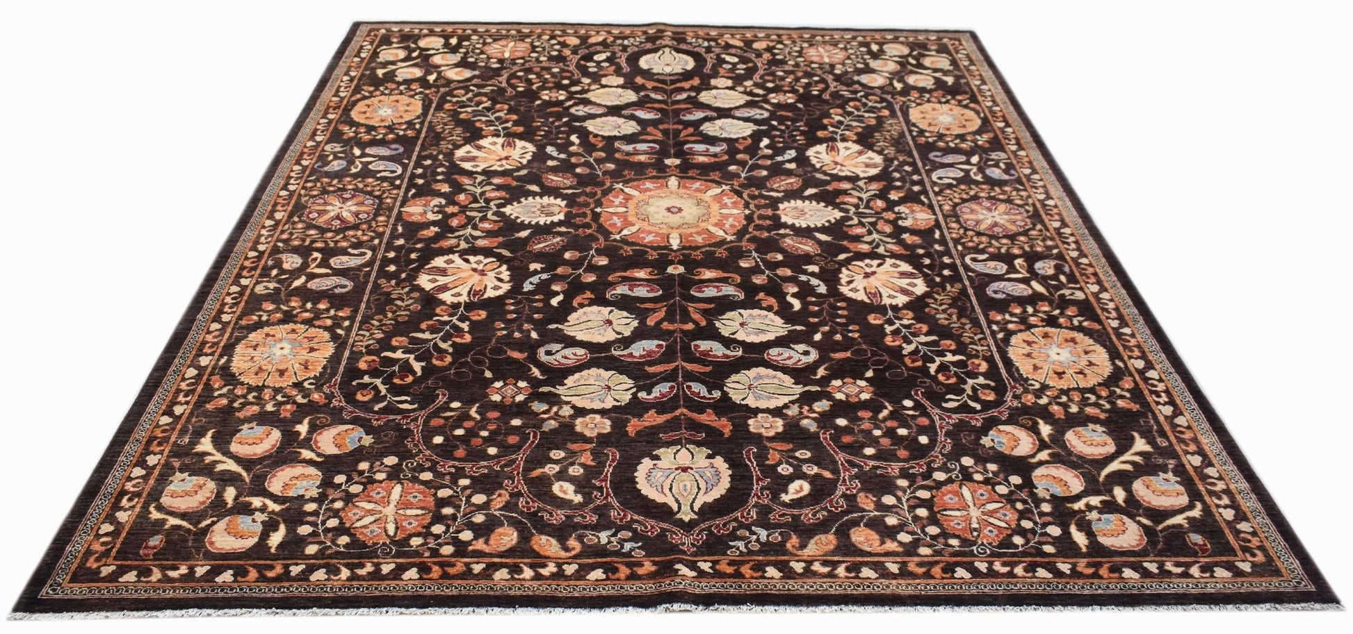 Handwoven Afghan Chobi rug featuring a traditional floral Suzani pattern on a dark brown background.