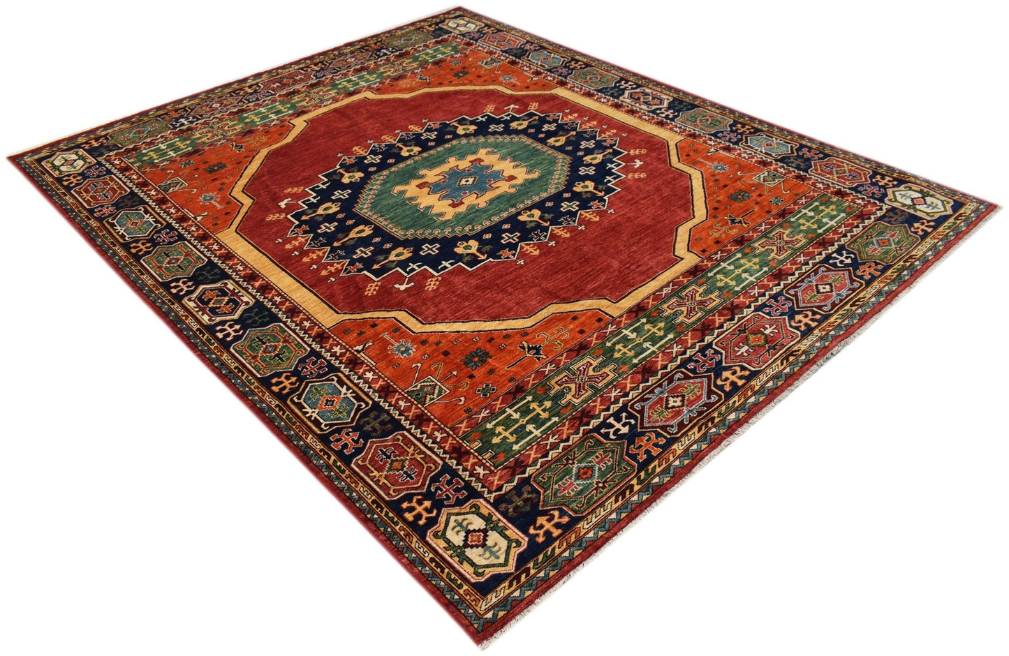 A rectangular Afghan Chobi rug featuring a central medallion with intricate geometric patterns.