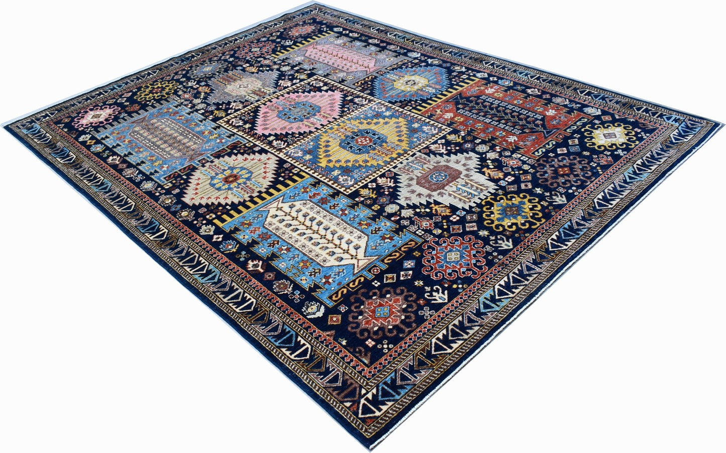 A rectangular Afghan Chobi rug featuring a dark blue field with colorful geometric medallions.