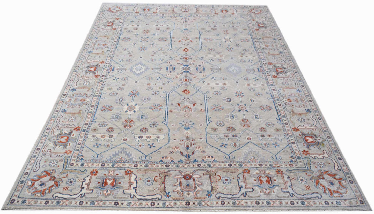 A rectangular Afghan Chobi rug featuring a traditional floral pattern in blue, red, and beige.