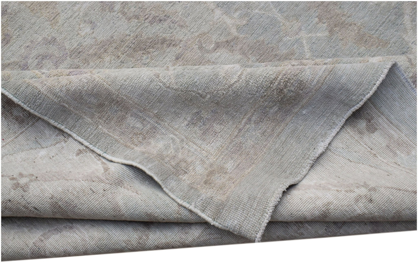 A handwoven Afghan Balkh rug featuring a traditional pattern in soft grey and beige tones.