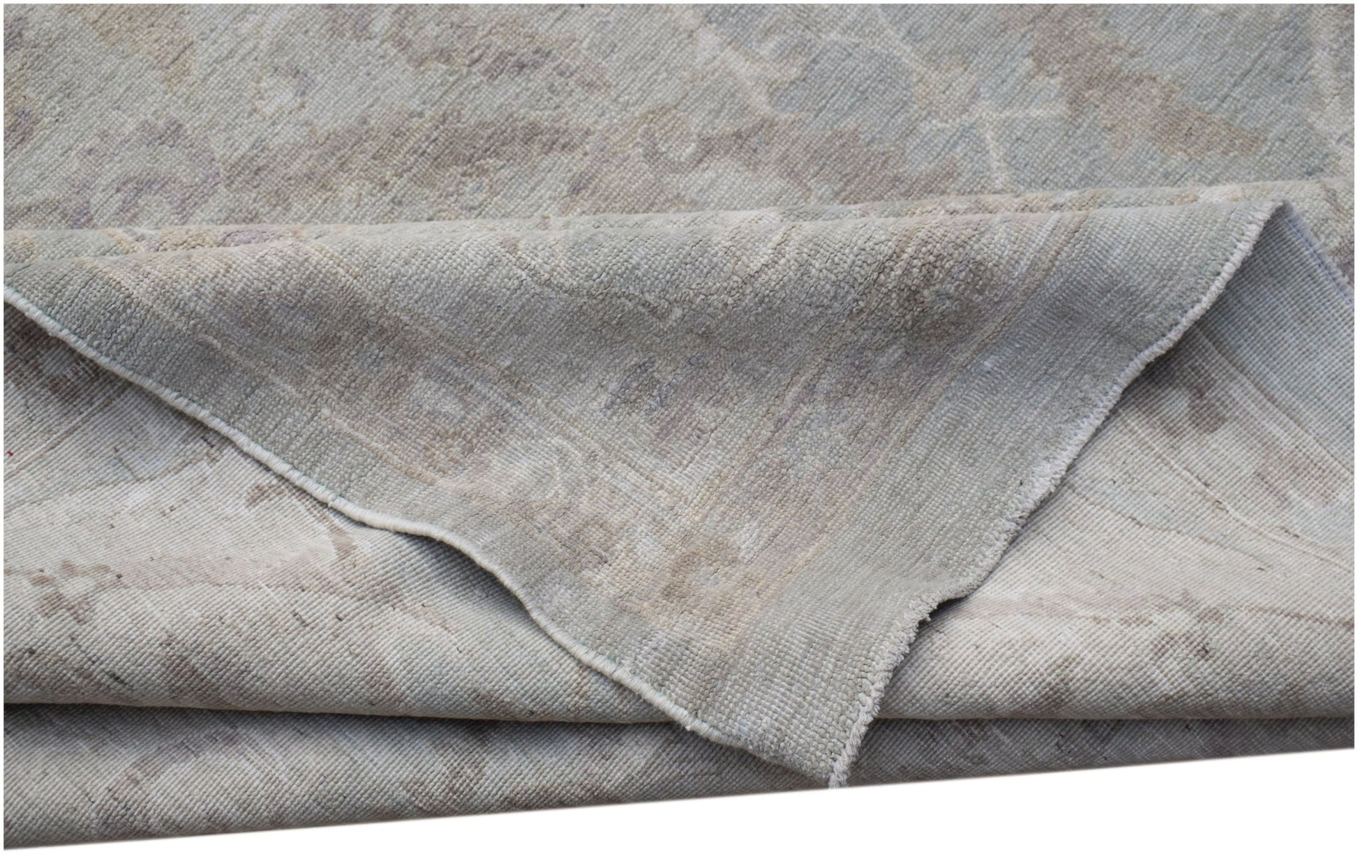 A handwoven Afghan Balkh rug featuring a traditional pattern in soft grey and beige tones.