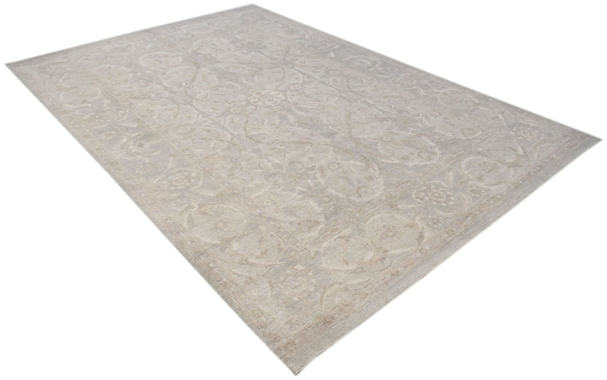 A handwoven Afghan Balkh rug featuring a traditional floral pattern in soft neutral tones.