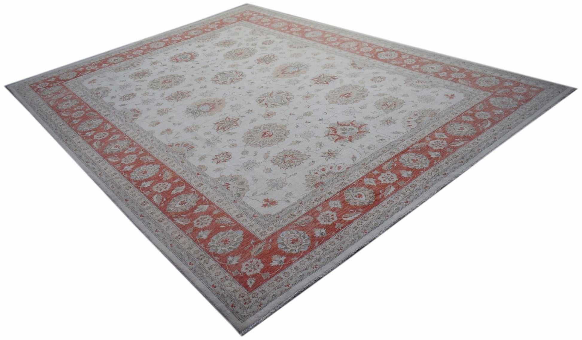A rectangular Afghan Chobi rug featuring a floral pattern in muted red and cream tones.