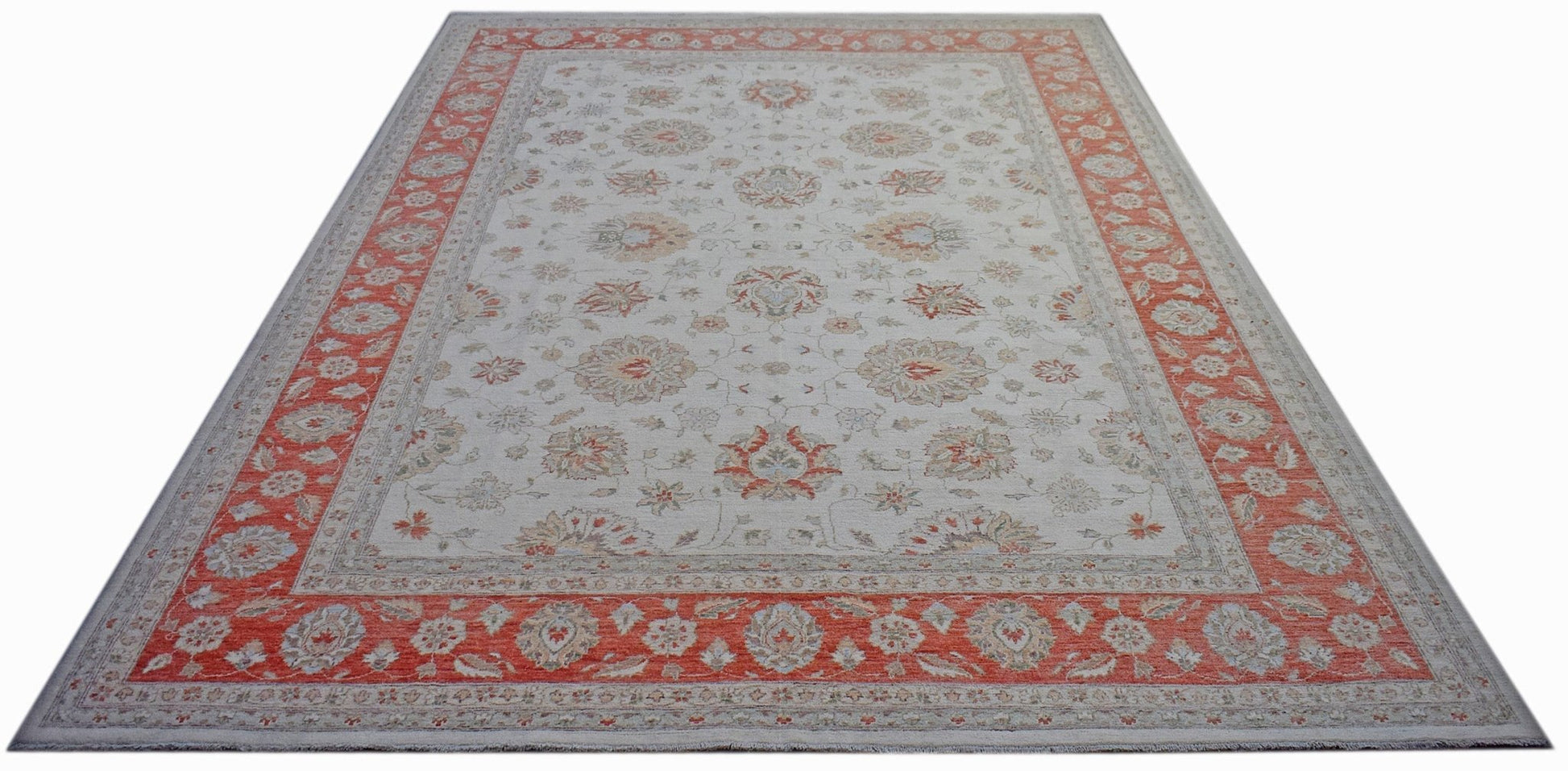 A rectangular Afghan Chobi rug featuring a floral pattern in muted tones with a wide orange border.