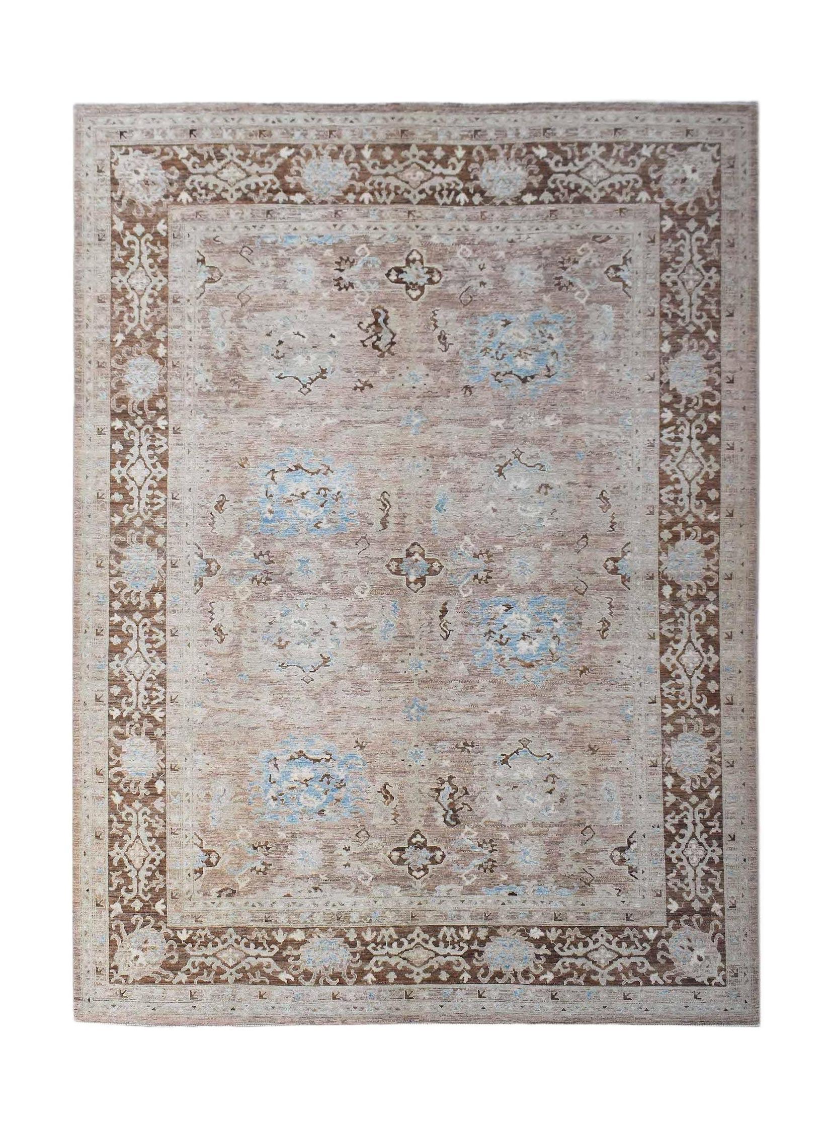 A rectangular transitional Oushak rug featuring a brown and blue floral pattern on a beige field.