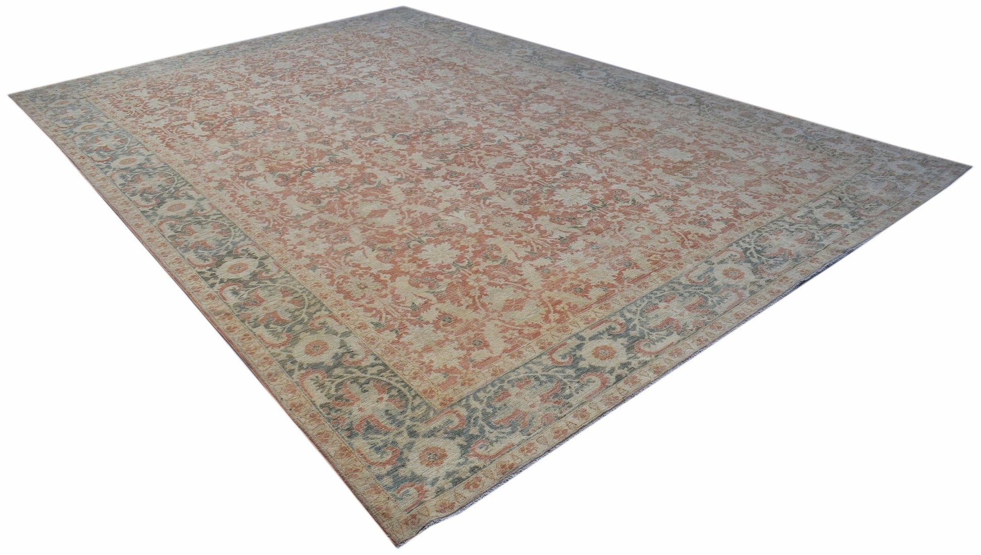 A rectangular Afghan Balkh rug featuring a traditional floral pattern in muted orange and grey.