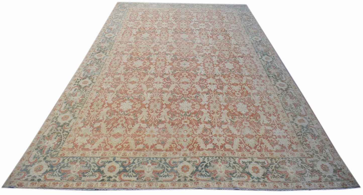 A rectangular Afghan Balkh rug featuring a traditional floral pattern in muted orange and grey tones.
