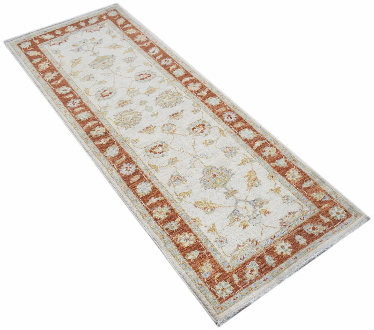 An Afghan Chobi runner rug featuring a traditional floral pattern in rust and cream tones.