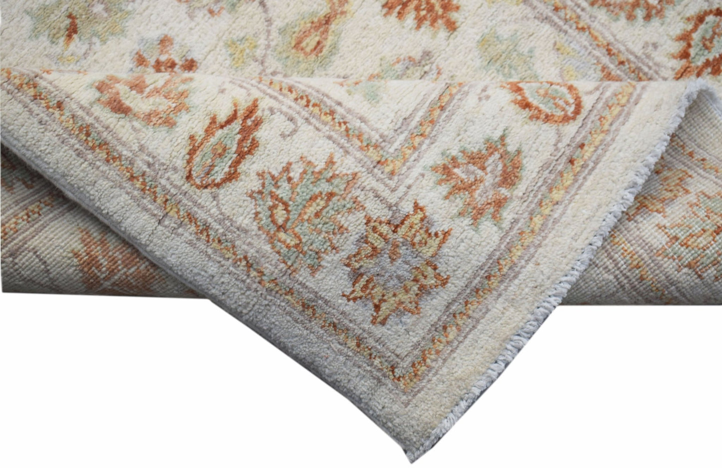 A handwoven Afghan Chobi runner featuring traditional floral patterns in soft earth tones.