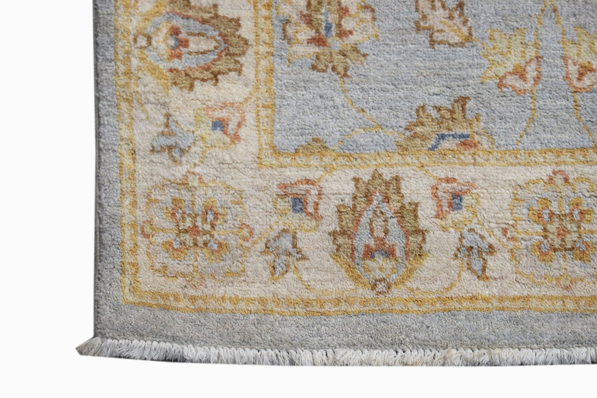 A handwoven Afghan Chobi runner featuring a light blue field with traditional floral patterns.
