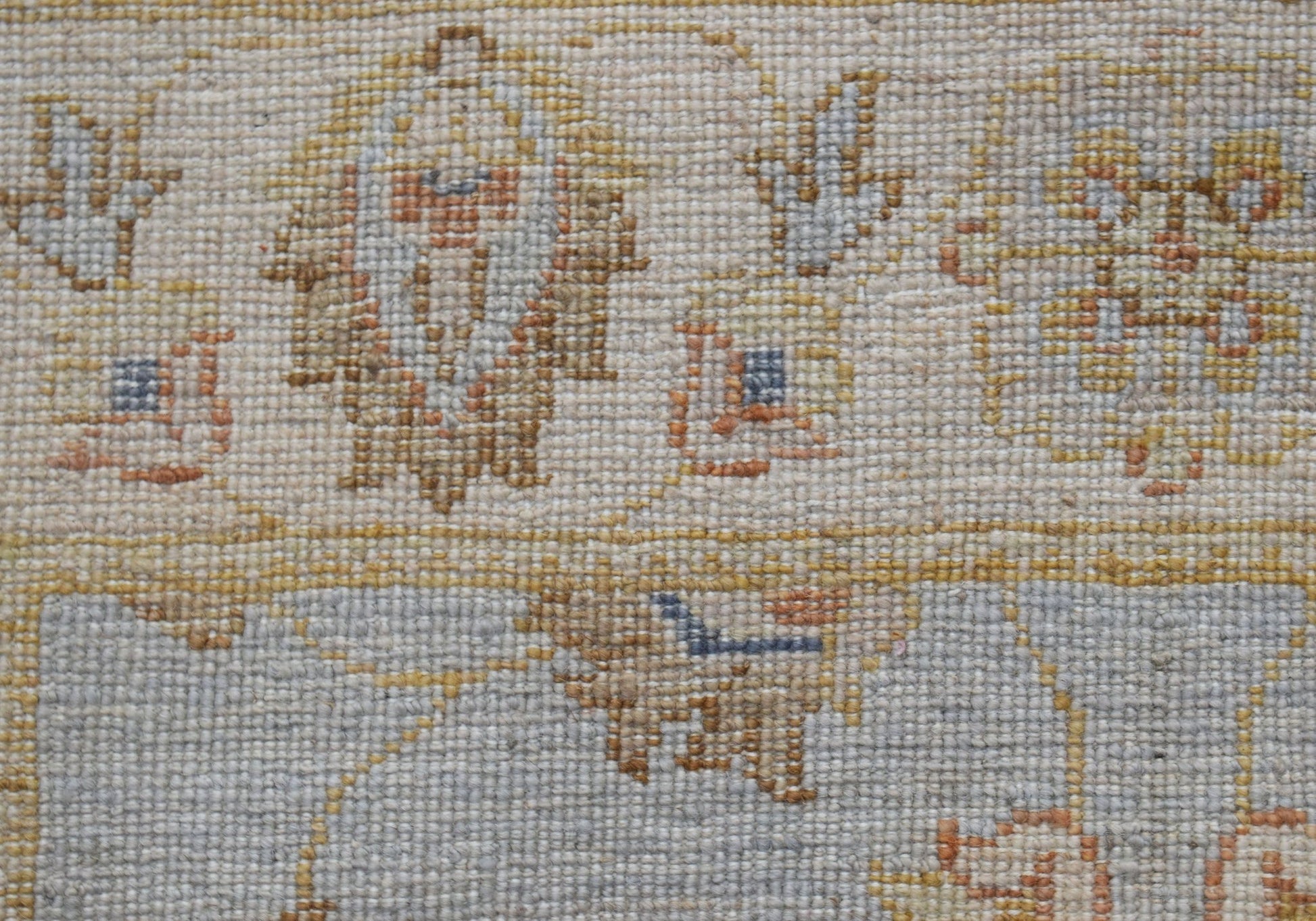A close-up of an Afghan Chobi runner featuring intricate traditional patterns in earthy tones.