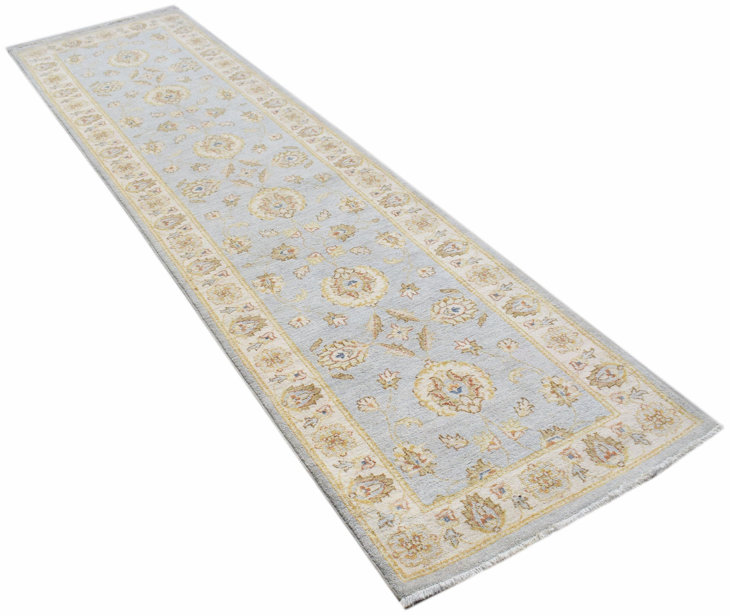 An Afghan Chobi runner rug featuring a traditional floral pattern in soft blue and beige tones.