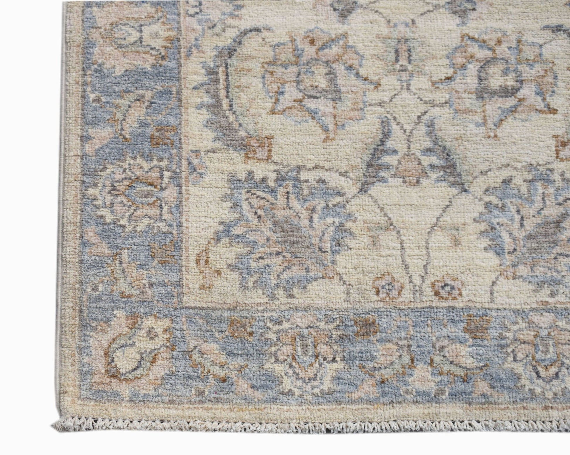 A handwoven Afghan Chobi runner featuring a traditional floral pattern in soft blue and beige tones.