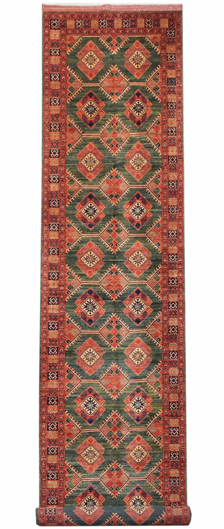 Handwoven Afghan Chobi runner rug featuring a repeating diamond pattern in green and rust tones.