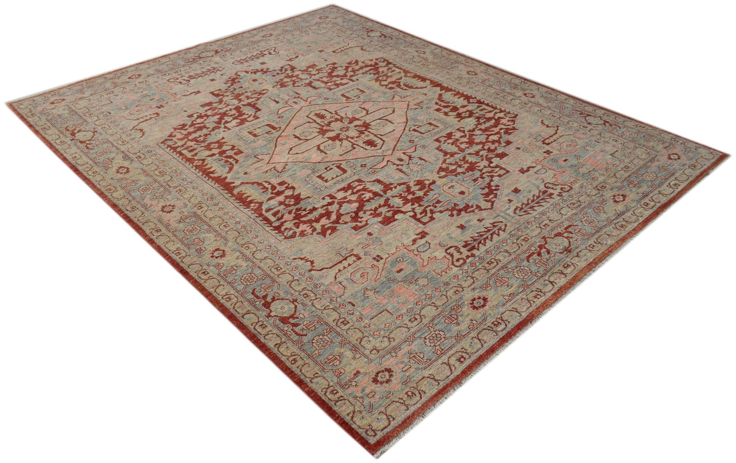 A handwoven Afghan Chobi rug featuring a traditional Heriz pattern in red and muted blue tones.