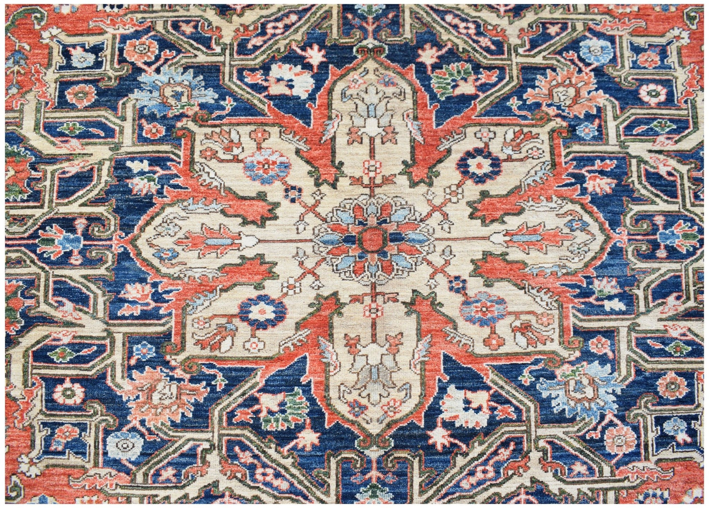 A handmade Afghan Chobi rug featuring a traditional Heriz geometric pattern in blue and red.